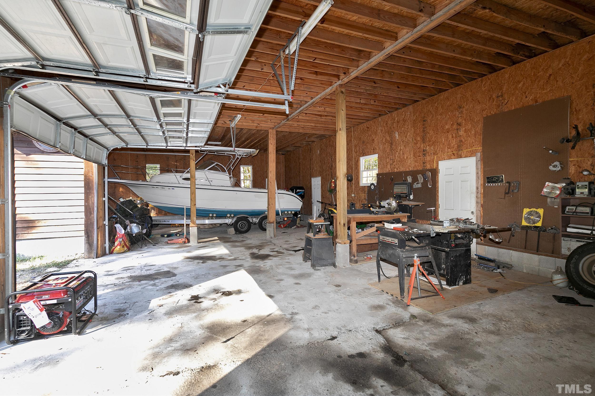 1300 Major Slade Road Wendell, NC 27591 - Photo 28 of 30 Large oversized 4 car garage with ample workshop area!