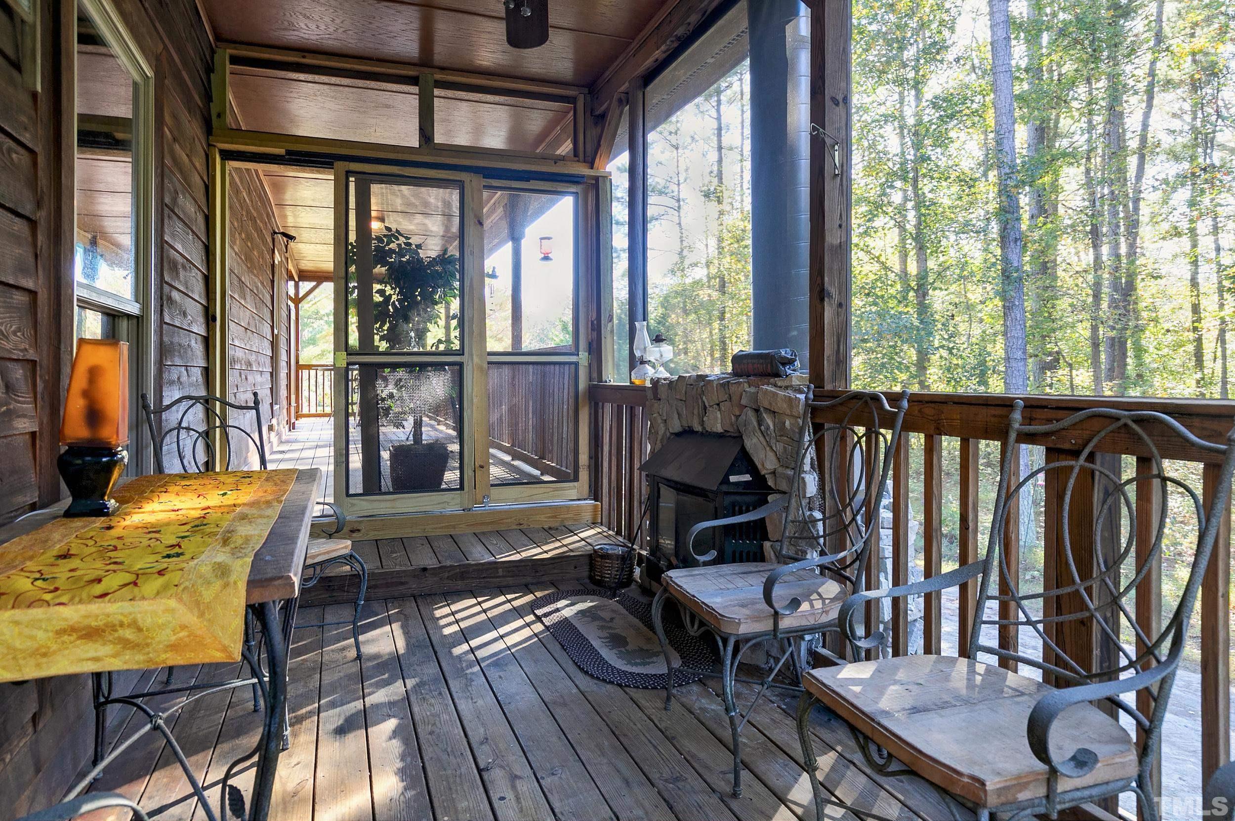1300 Major Slade Road Wendell, NC 27591 - Photo 7 of 30 Enjoy this porch all year! Wood stove warms this space in the cooler months!