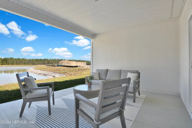 a view of chairs and table in patio