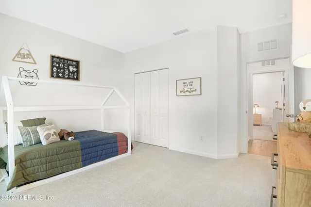 a view of room with furniture and wooden floor