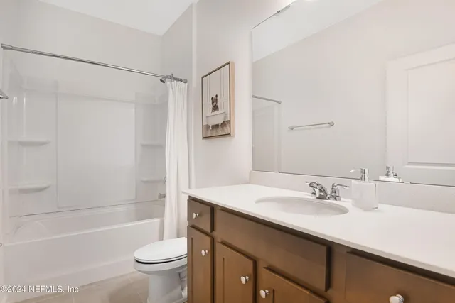 a bathroom with a sink a toilet and a bathtub