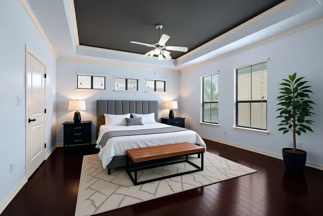 a bed room with a bed and a potted plant