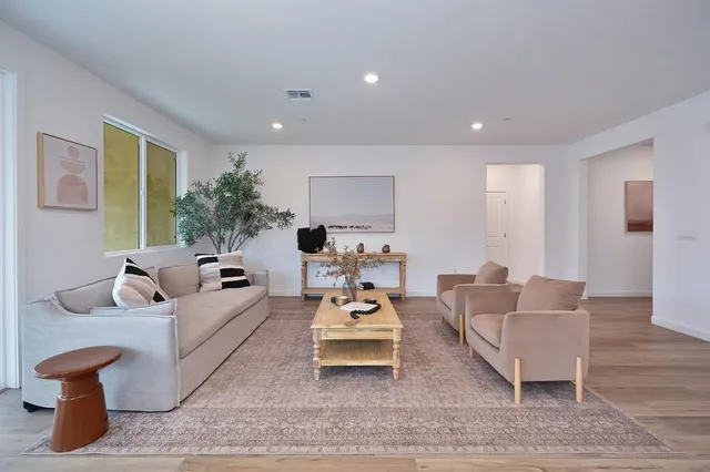 a living room with furniture and a table