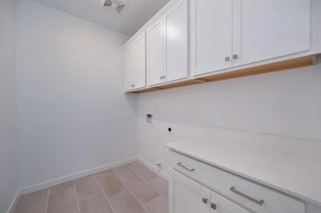 a bathroom with a double vanity sink mirror and shower