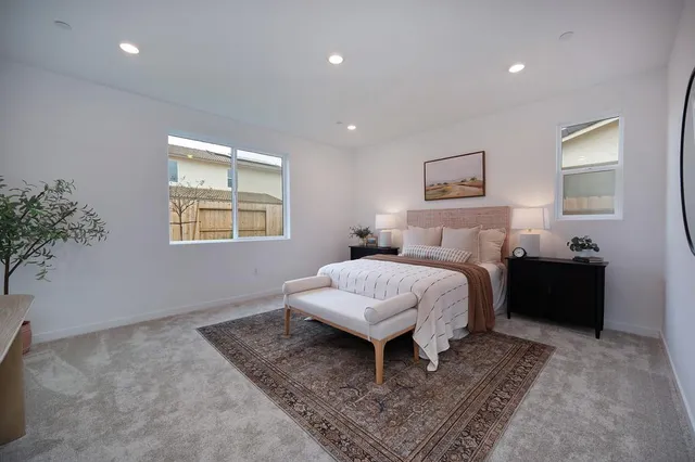 a bedroom with a bed and a dresser