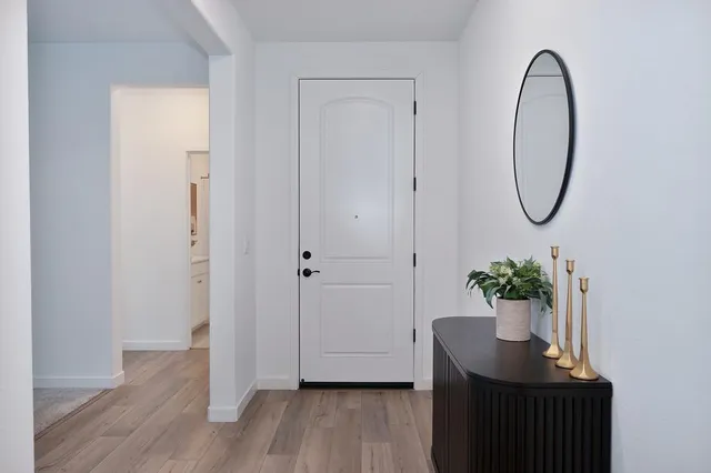 a view of a workspace with furniture