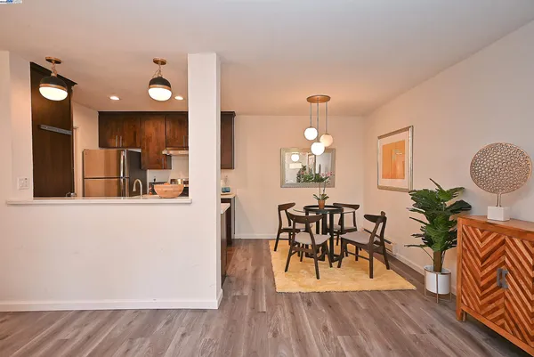 a view of a dining room with furniture and wooden floor