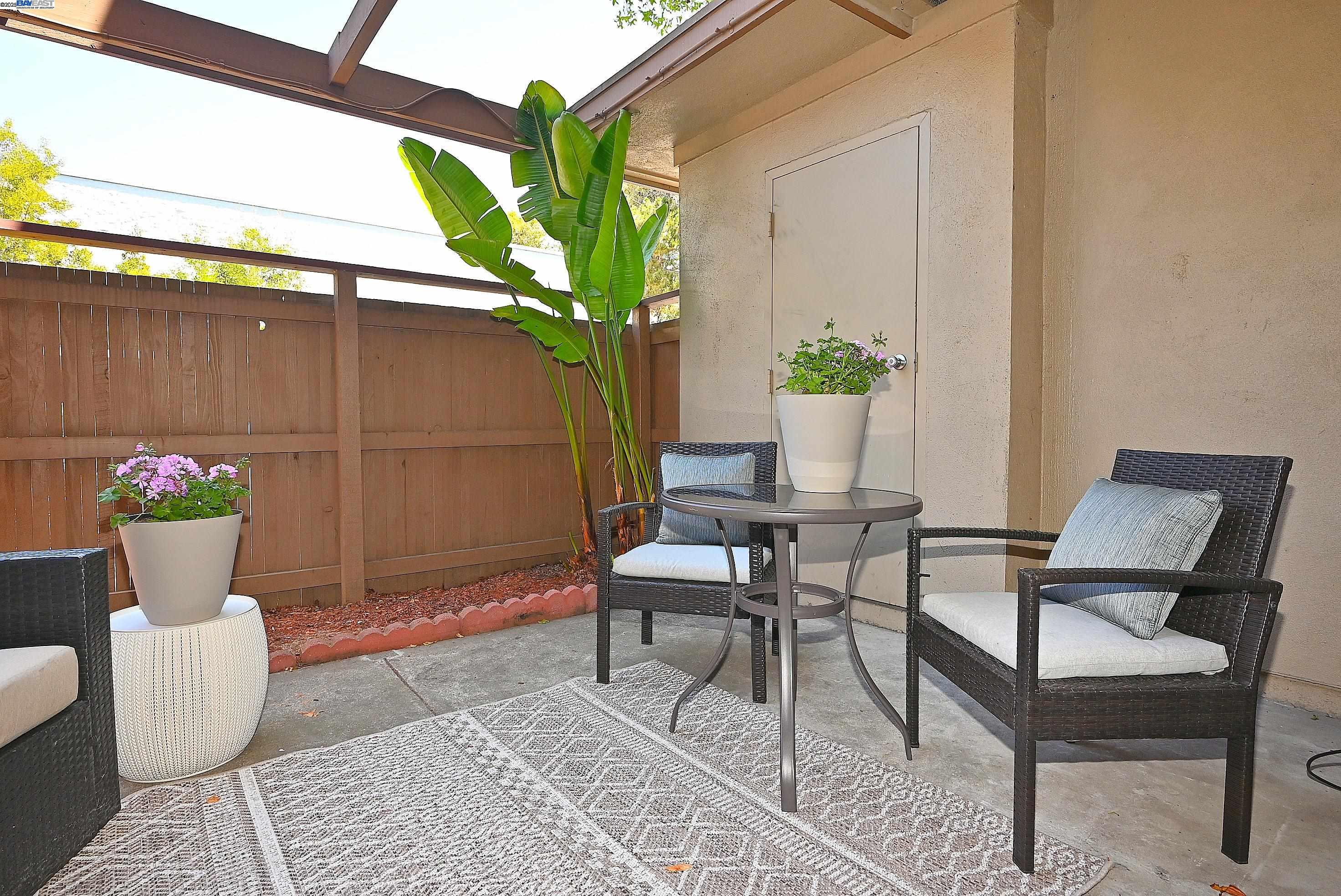 1333 Webster Street, Unit A107 Alameda, CA 94501 - Photo 26 of 27 a view of a chairs and table in a patio