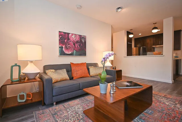 a living room with furniture and a lamp