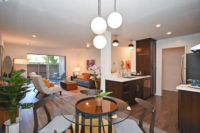 a large kitchen with a table and chairs