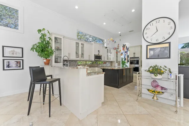 a kitchen with a table and chairs in it