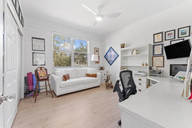 a view of a livingroom with furniture and a flat screen tv