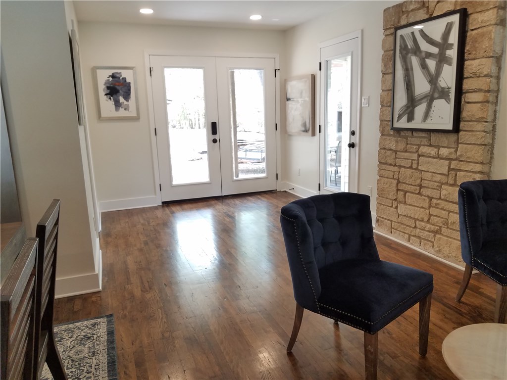 5405 Hudson Street Austin, TX 78721 - Photo 18 of 37 French doors and gleaming hardwood floors greet you in this welcoming living space.