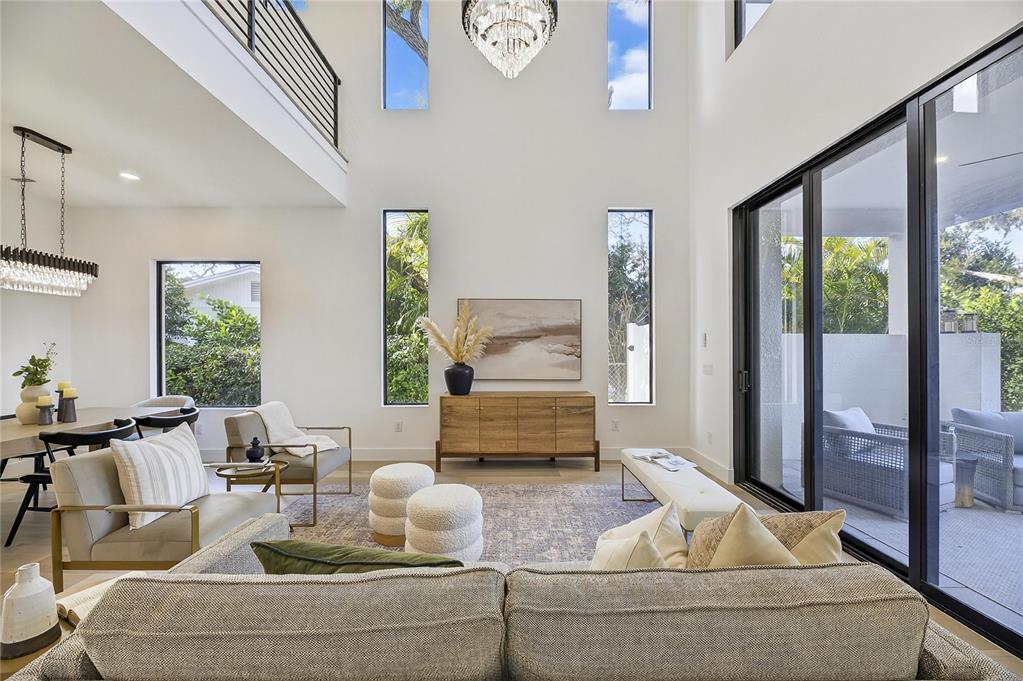 2335 Oak Terrace Sarasota, FL 34231 - Photo 14 of 82 a living room with furniture and floor to ceiling windows