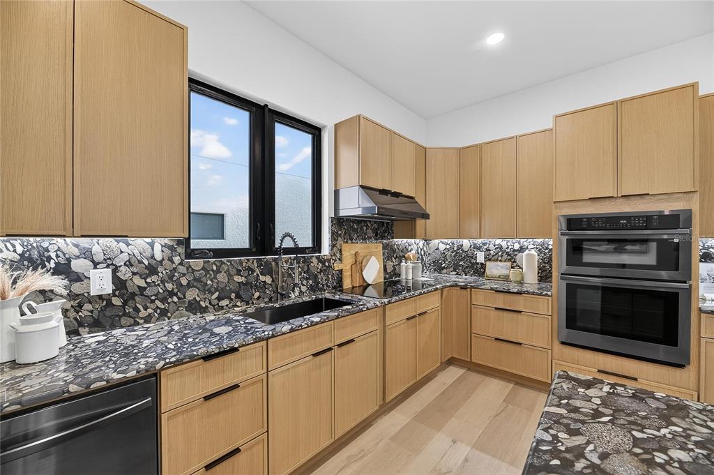 2335 Oak Terrace Sarasota, FL 34231 - Photo 23 of 82 a kitchen with stainless steel appliances granite countertop a sink stove and cabinets