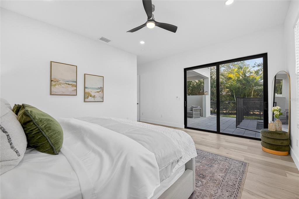 2335 Oak Terrace Sarasota, FL 34231 - Photo 28 of 82 a spacious bedroom with a large bed and a large window