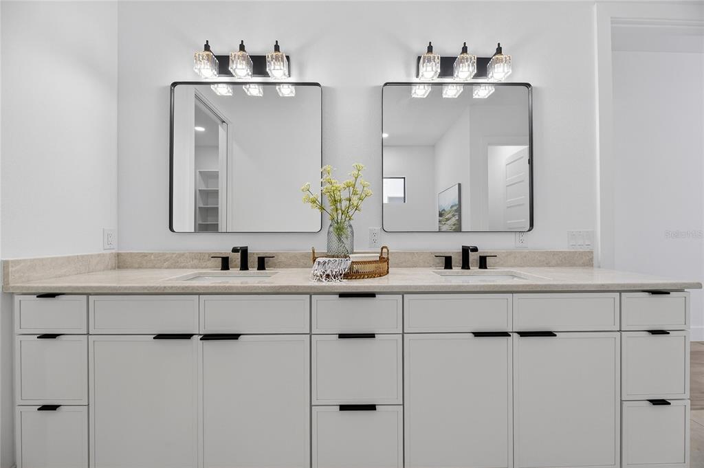 2335 Oak Terrace Sarasota, FL 34231 - Photo 35 of 82 a bathroom with double vanity sinks and a mirror