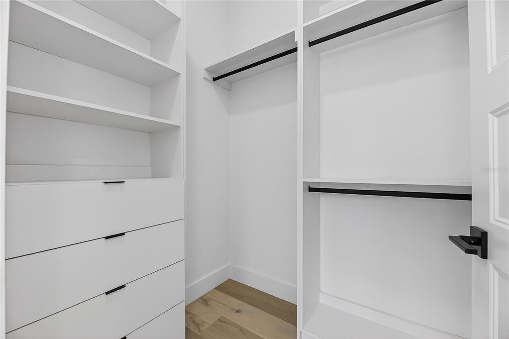 2335 Oak Terrace Sarasota, FL 34231 - Photo 45 of 82 a view of walk in closet with empty racks