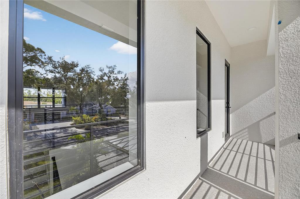 2335 Oak Terrace Sarasota, FL 34231 - Photo 49 of 82 a view of a balcony with wooden floor