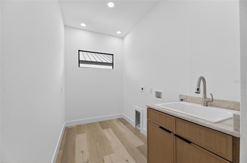 2335 Oak Terrace Sarasota, FL 34231 - Photo 58 of 82 a bathroom with a sink and a mirror