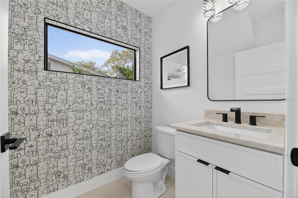 2335 Oak Terrace Sarasota, FL 34231 - Photo 8 of 82 a bathroom with a toilet sink and mirror