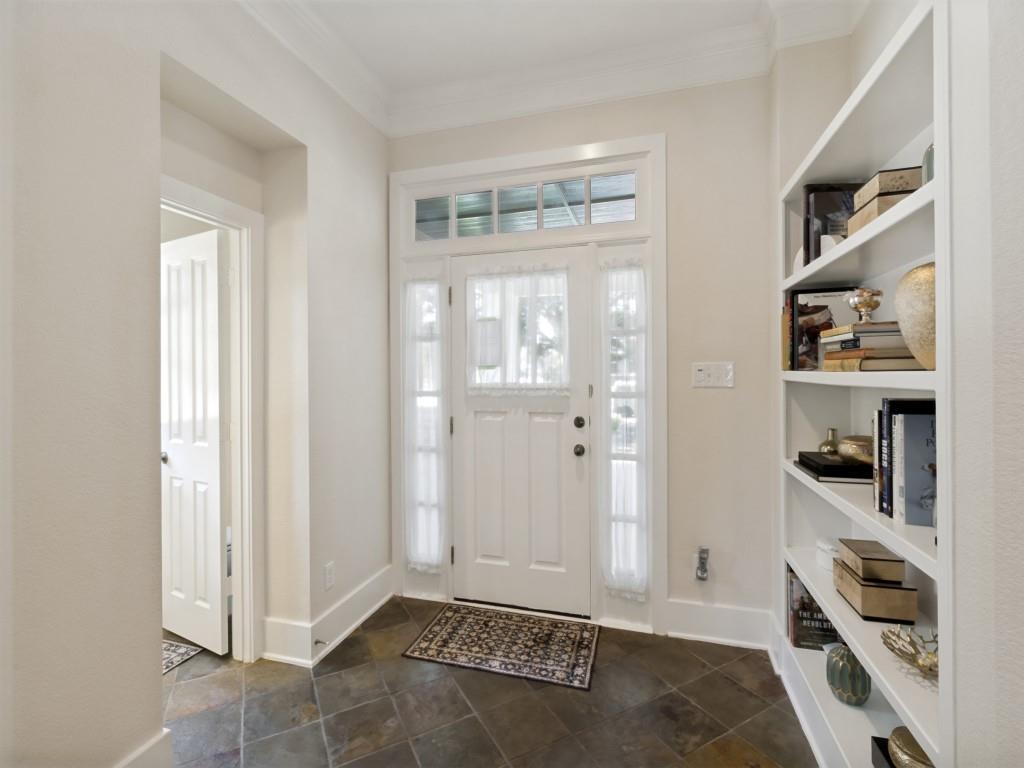 4947 Reiger Avenue Dallas, TX 75214 - Photo 3 of 35 foyer with shelving and entrance to half bath