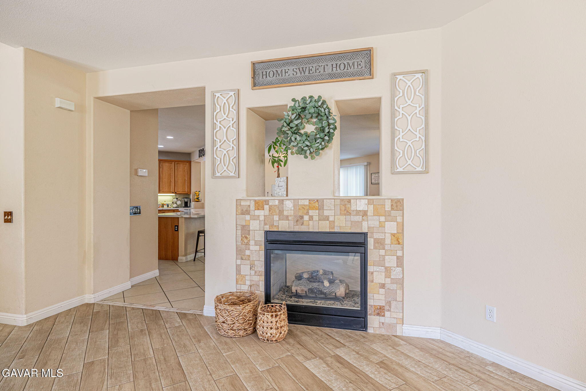 4302 Olivera Place Lancaster, CA 93536 - Photo 13 of 62 a living room with furniture and a fireplace