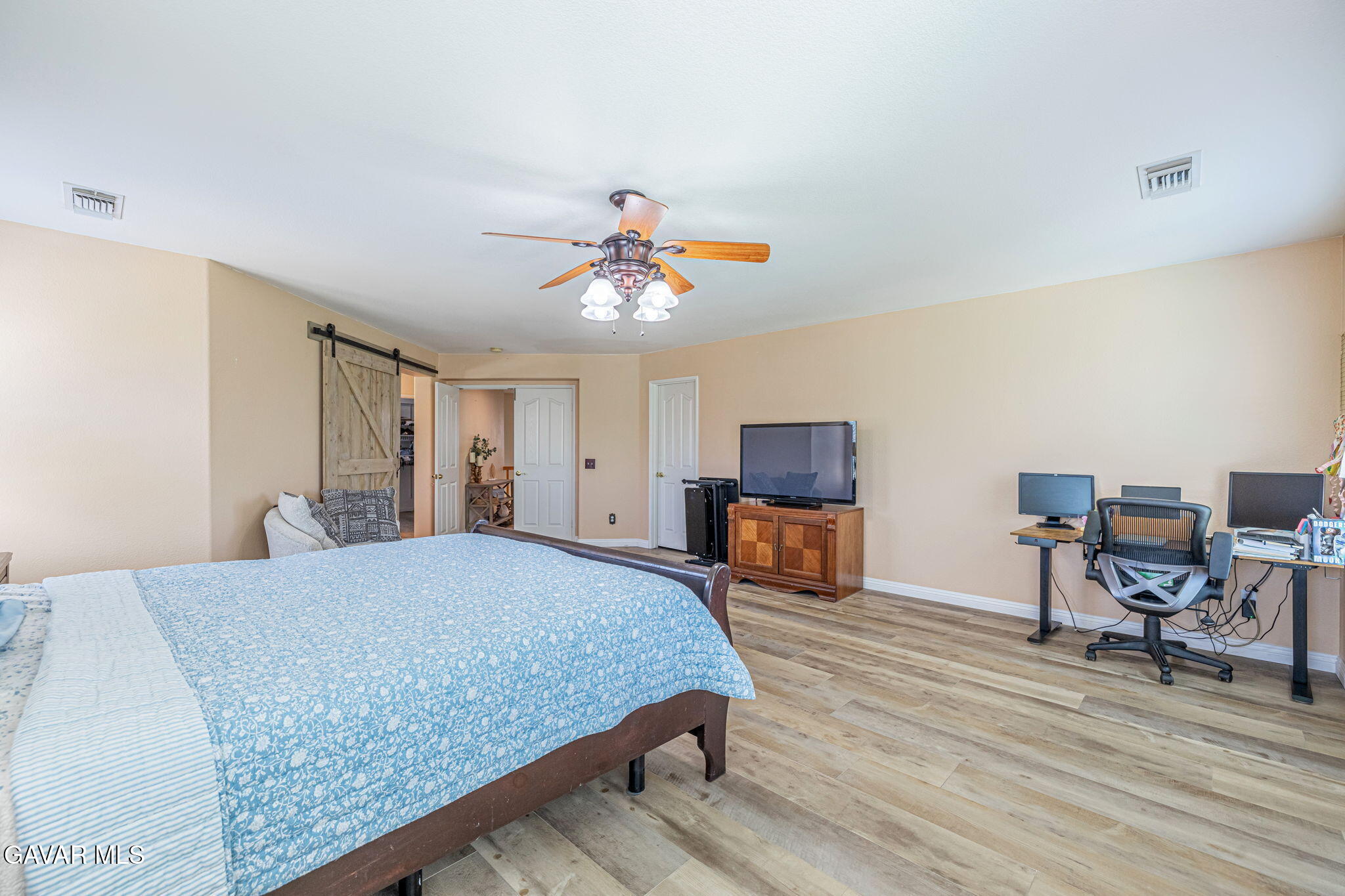 4302 Olivera Place Lancaster, CA 93536 - Photo 28 of 62 a bedroom with a bed a table and chair