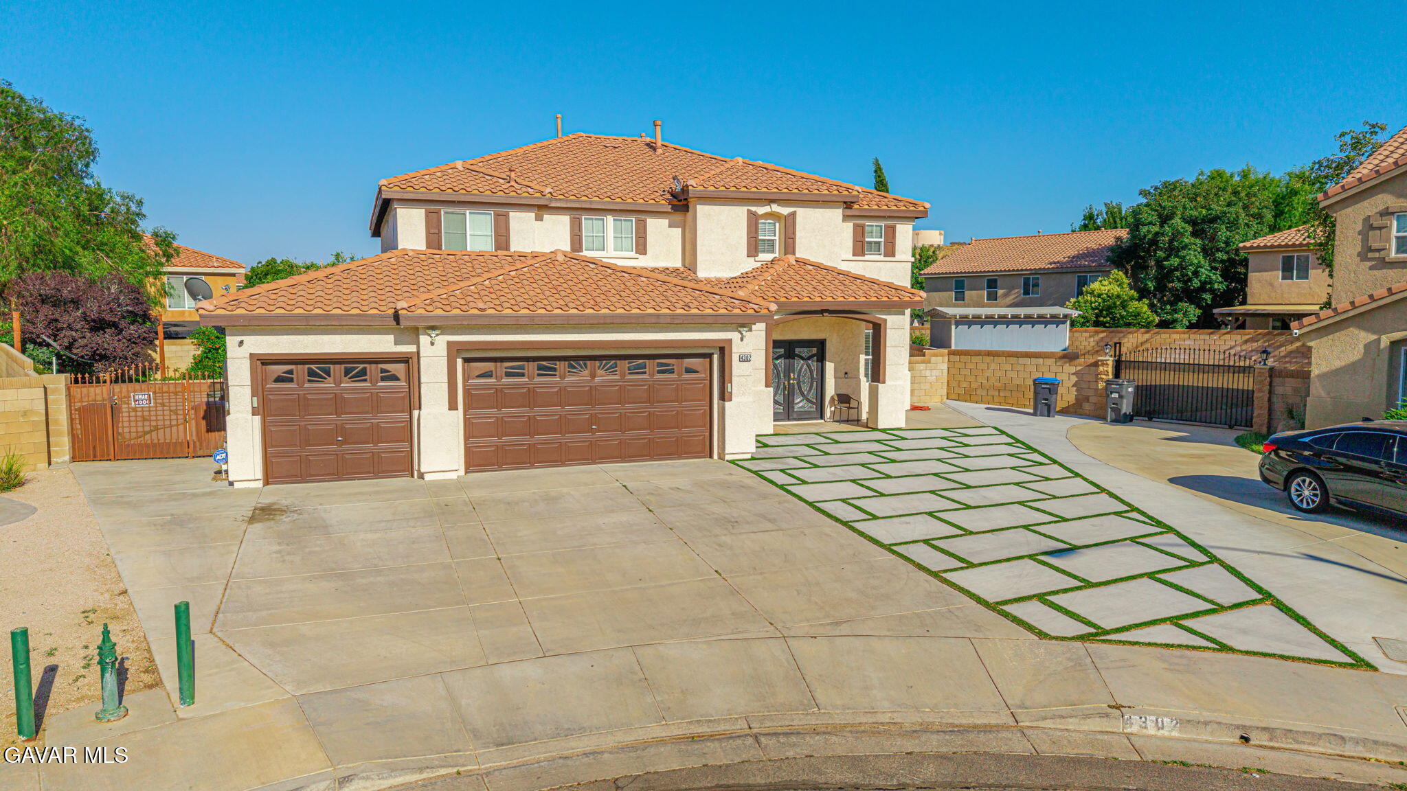 4302 Olivera Place Lancaster, CA 93536 - Photo 51 of 62 a front view of a house with a yard