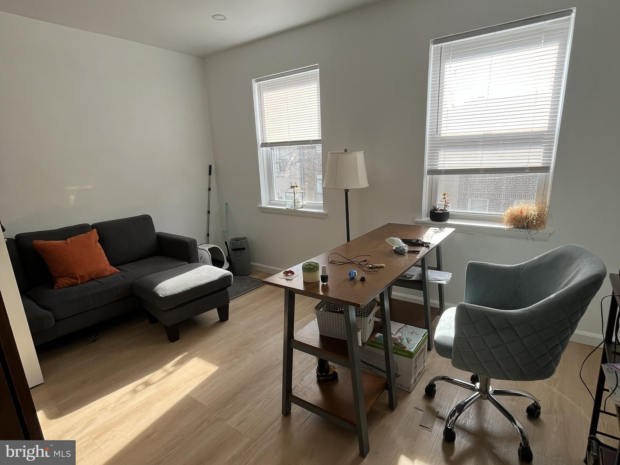 1929 Titan Street Philadelphia, PA 19146 - Photo 2 of 20 a work room with furniture wooden floor and a window