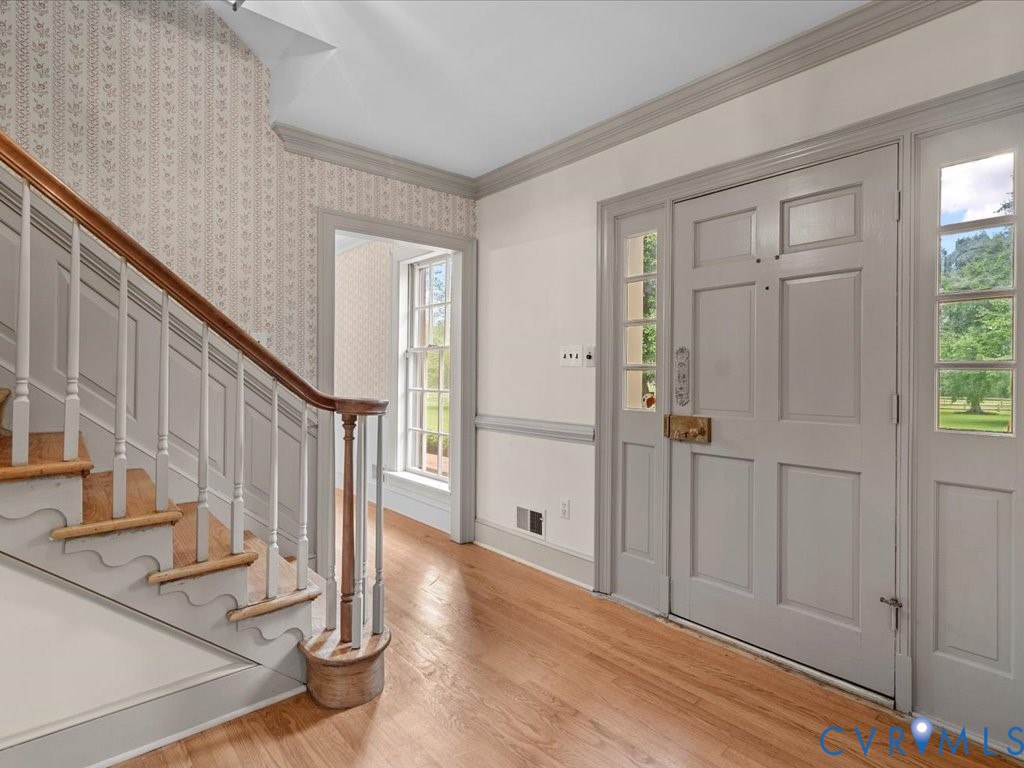 7350 State Rte 1196 Mechanicsville, VA 23111 - Photo 13 of 50 Entrance foyer with crown molding, stairway, light
