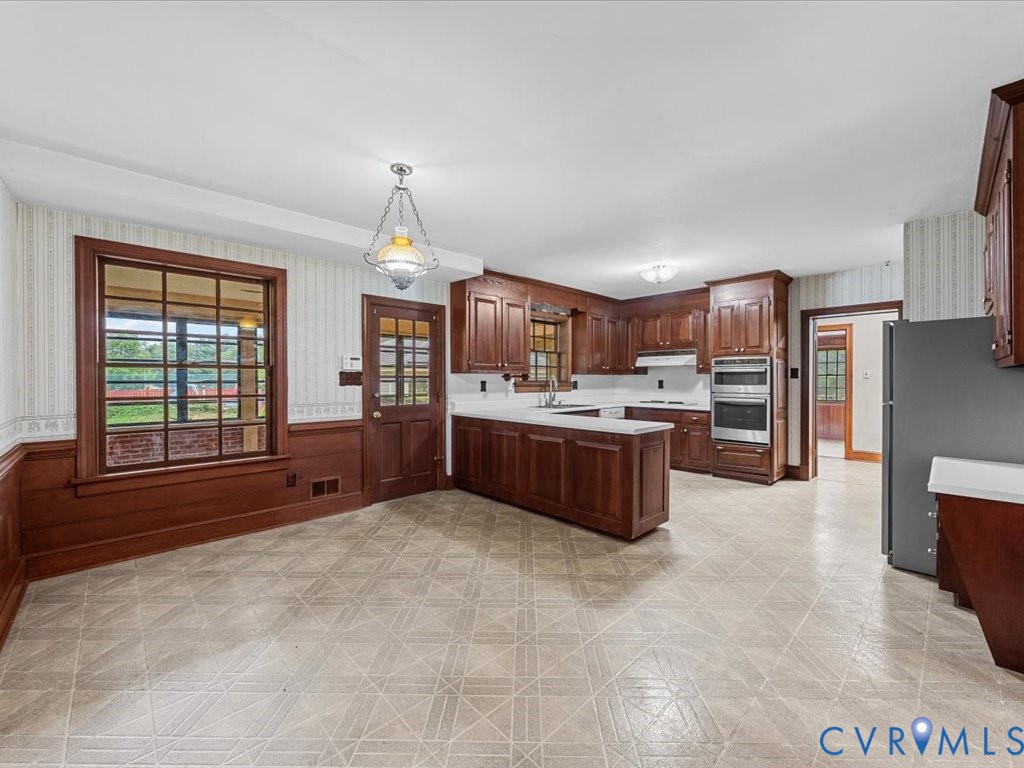 7350 State Rte 1196 Mechanicsville, VA 23111 - Photo 27 of 50 a large kitchen with a stove and cabinets