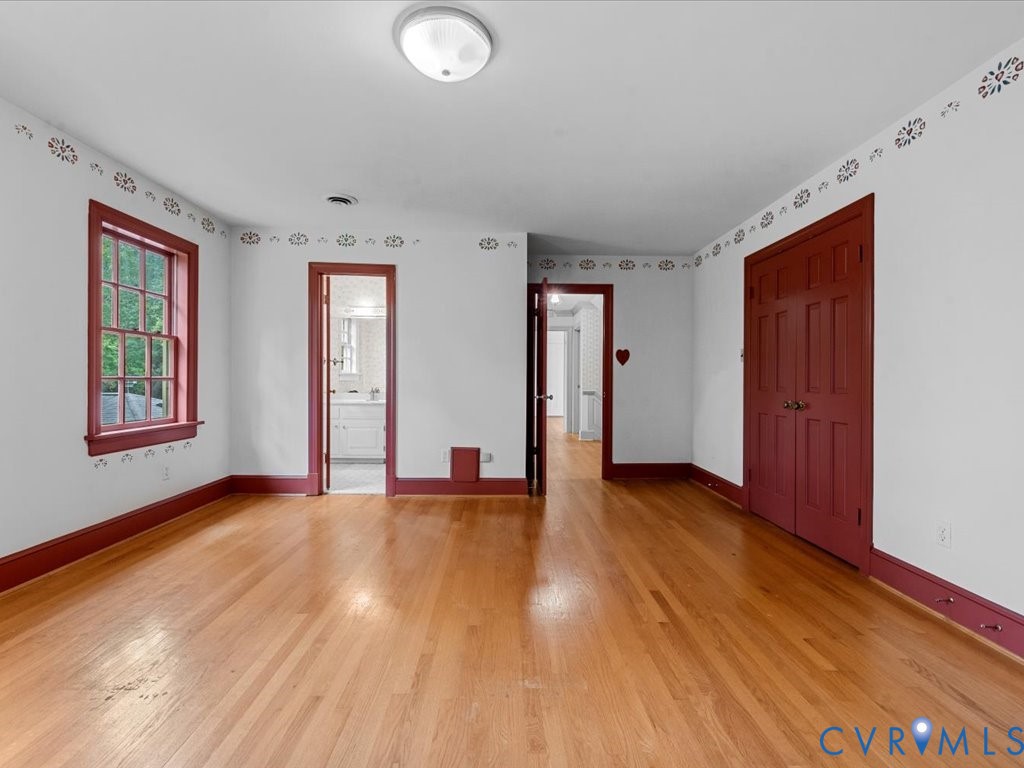 7350 State Rte 1196 Mechanicsville, VA 23111 - Photo 44 of 50 a view of an empty room with window and wooden floor