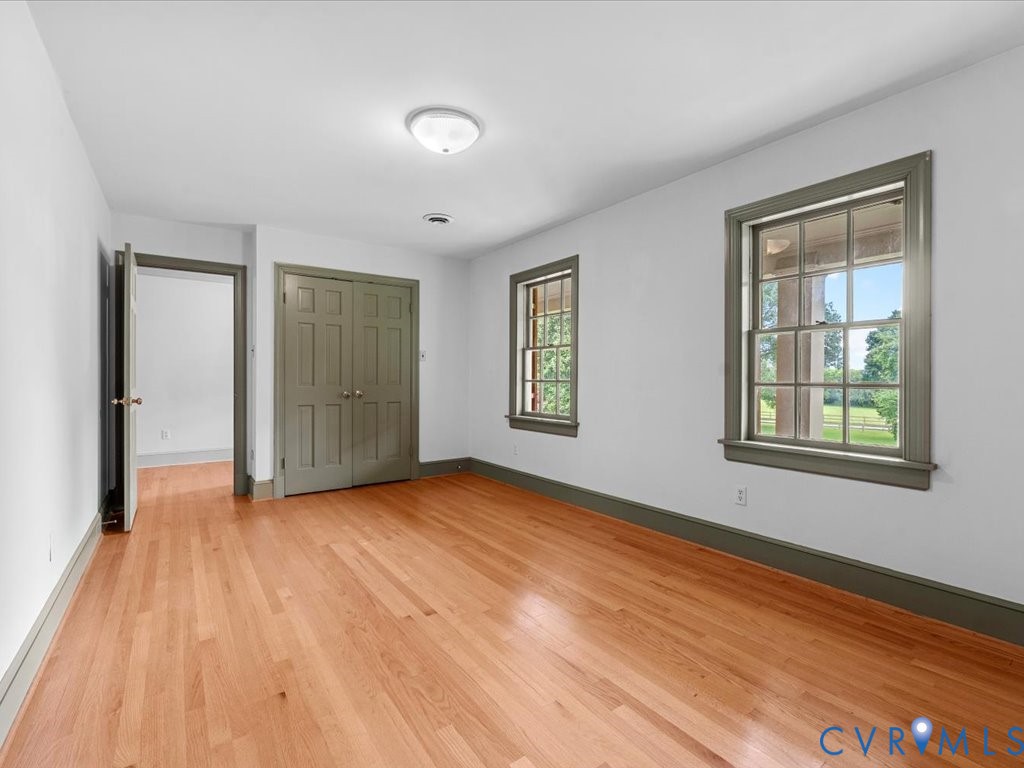 7350 State Rte 1196 Mechanicsville, VA 23111 - Photo 47 of 50 an empty room with wooden floor and windows