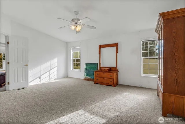 a living room with furniture and windows