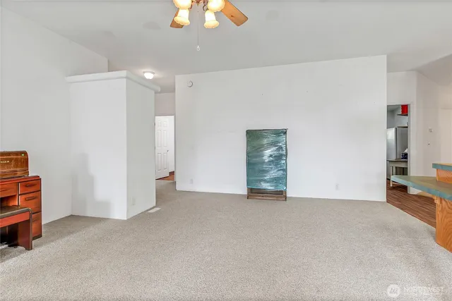 a view of an empty room with a cabinet