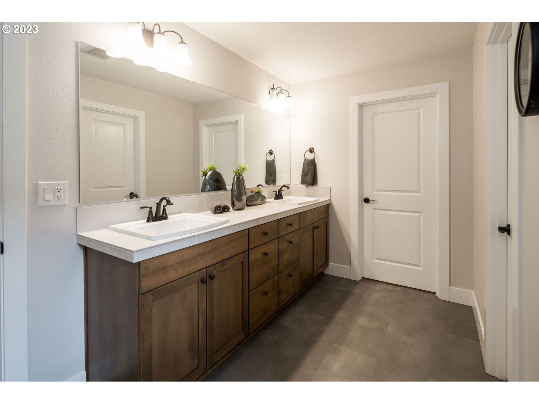 17531 Northwest 7th Avenue Ridgefield, WA 98642 - Photo 19 of 27 a bathroom with a sink double vanity and a mirror
