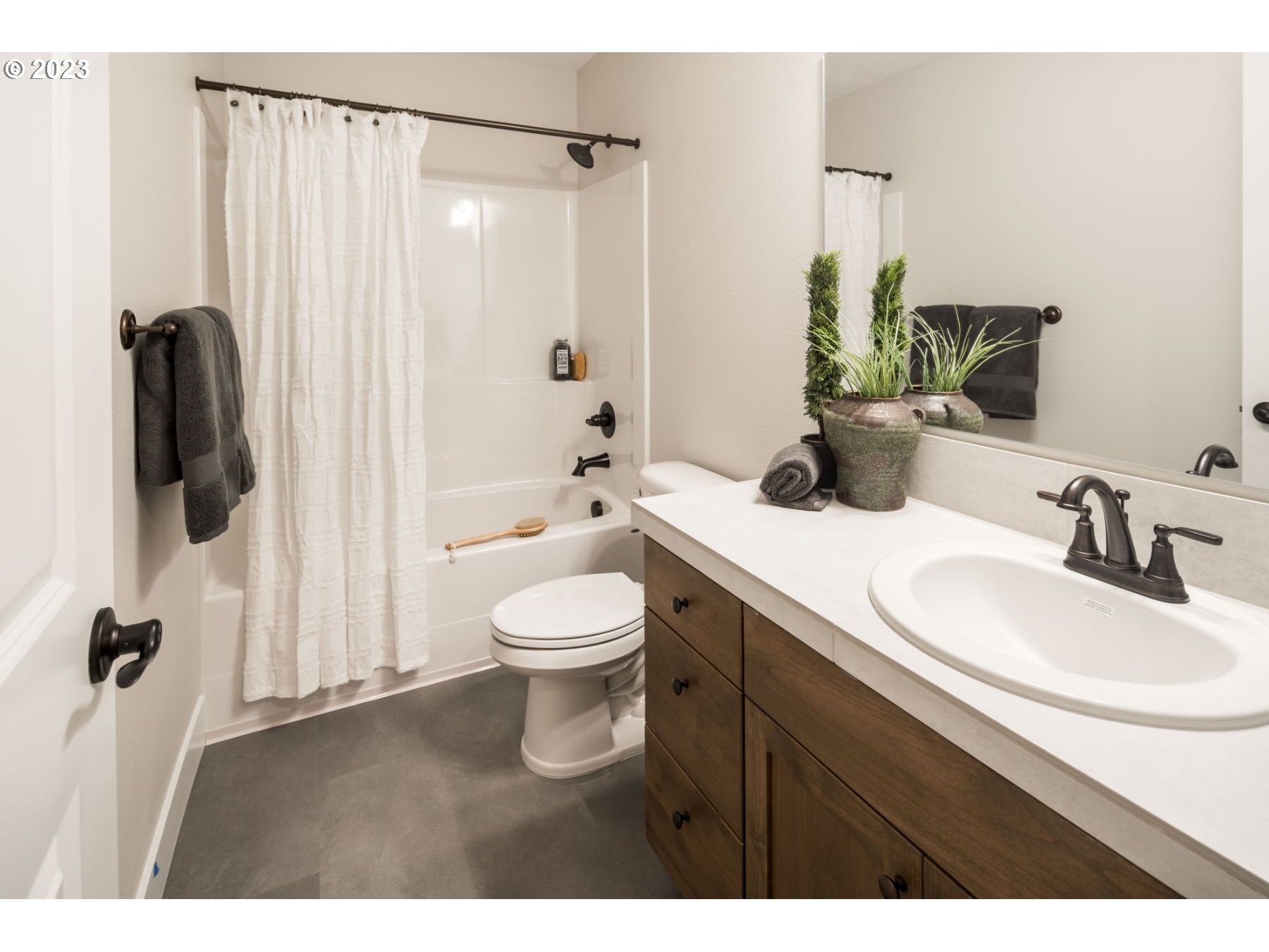 17531 Northwest 7th Avenue Ridgefield, WA 98642 - Photo 24 of 27 a bathroom with a sink a toilet and shower