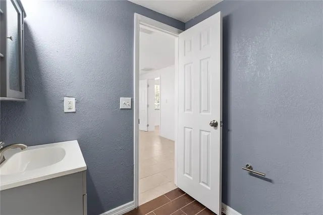 a bathroom with a sink and shower