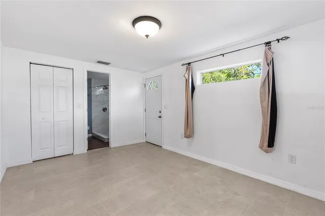 a view of an empty room with a window