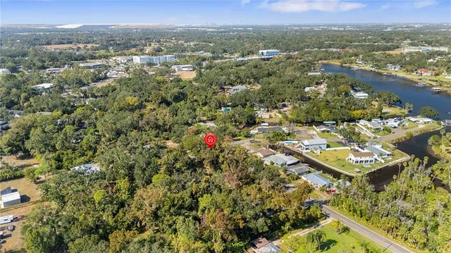 an aerial view of a residential houses with city view and lake view