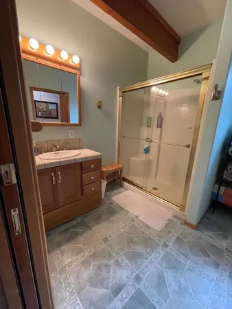 a view of a bathroom with sink and mirror