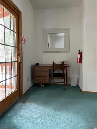 a room that has a bed and a window