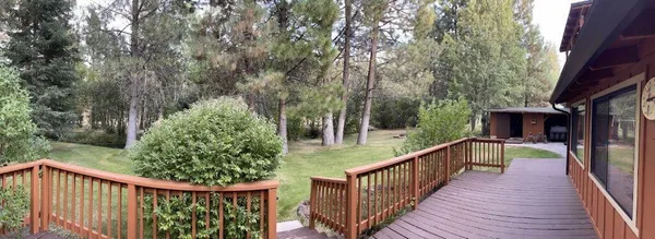 a view of a balcony with wooden floor