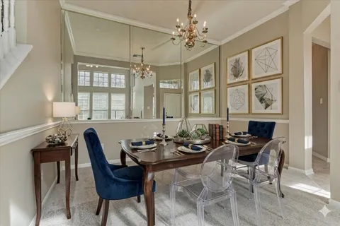 a view of an empty room with a fireplace and a window