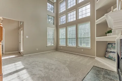 a kitchen with a refrigerator and a stove