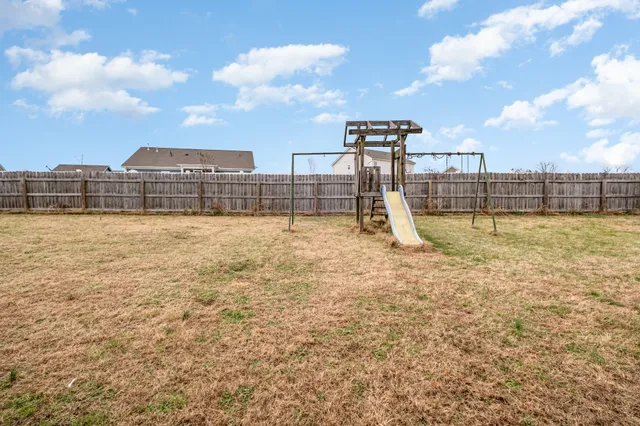 a view of a swimming pool with a terrace