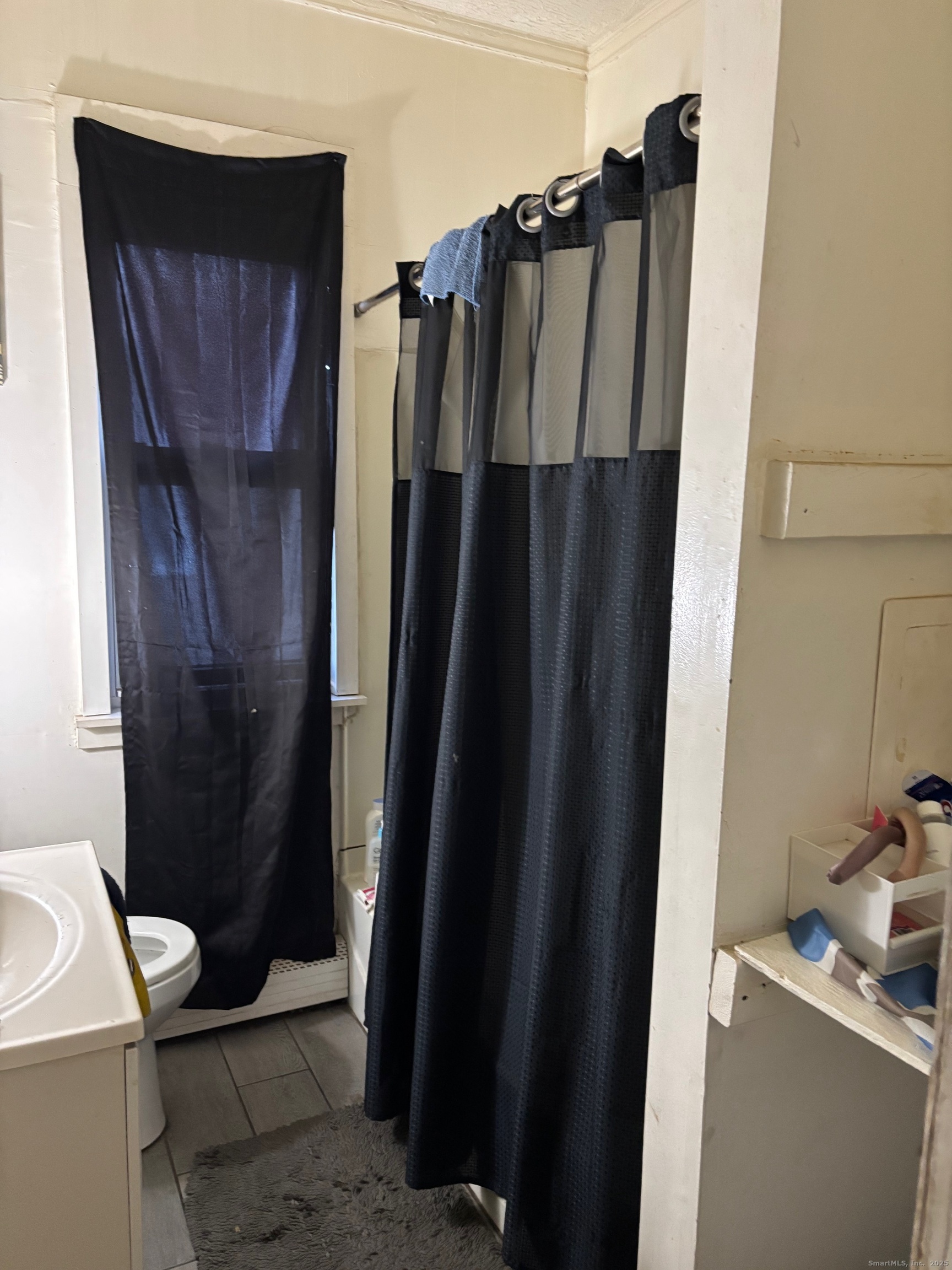 464 Wilmot Avenue Bridgeport, CT 06607 - Photo 12 of 19 a bathroom with a sink and a toilet