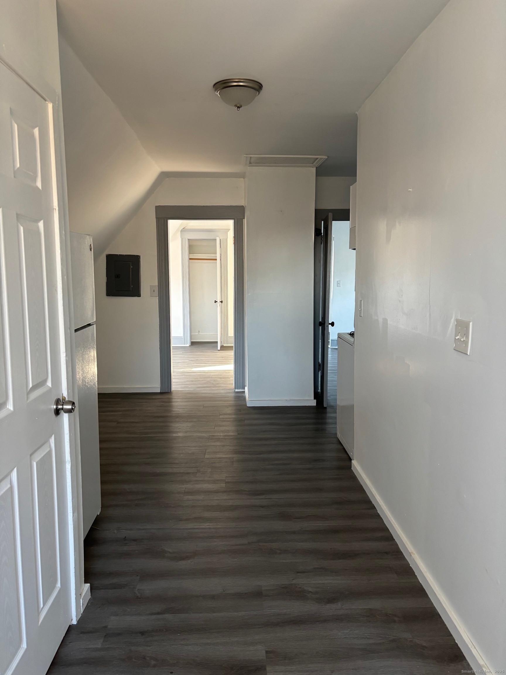 464 Wilmot Avenue Bridgeport, CT 06607 - Photo 13 of 19 a view of a hallway with wooden floor and staircase