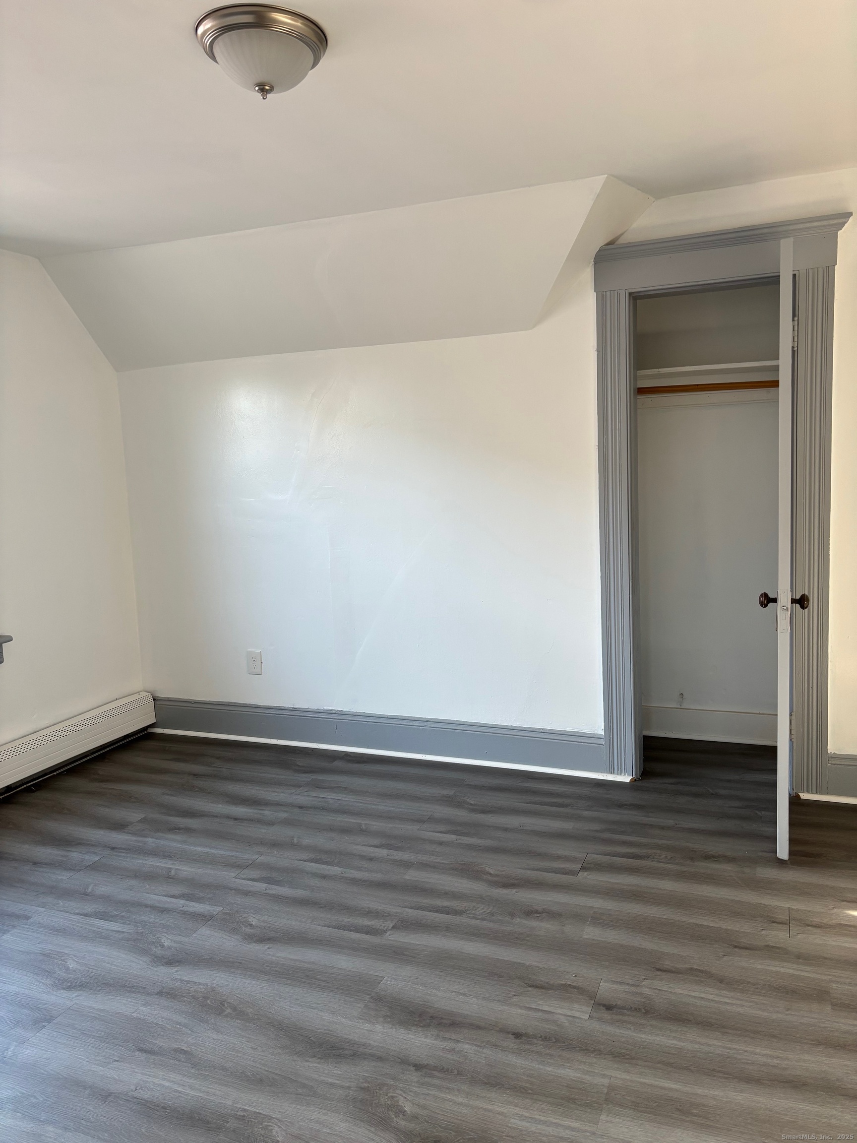 464 Wilmot Avenue Bridgeport, CT 06607 - Photo 14 of 19 a view of an empty room and wooden floor